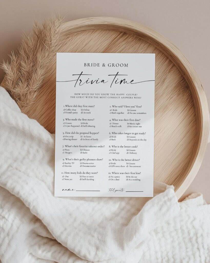 Trivia card for a bride and groom on a wooden tray with white fabric.